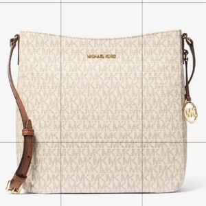 Barely used Excellent condition Michael Kors large cross body messenger bag.